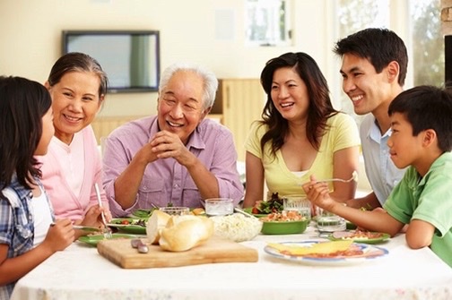 Multi-generation family at kitchen counter