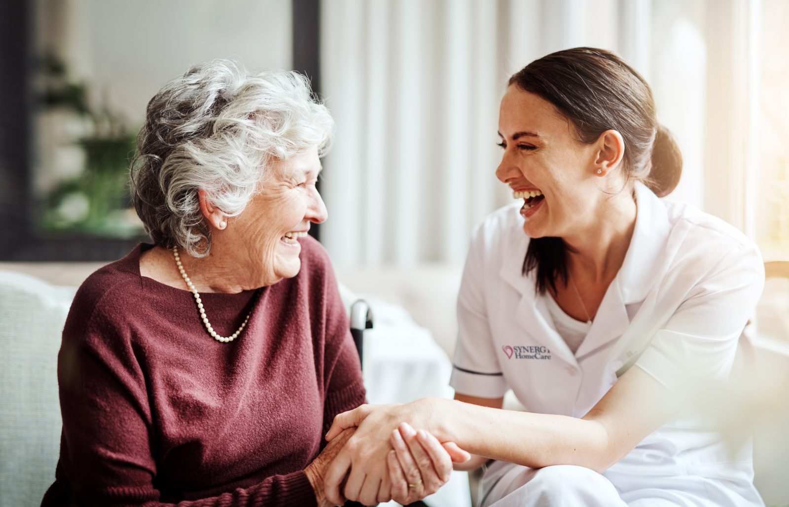 SYNERGY HomeCare caregiving socializing with client.