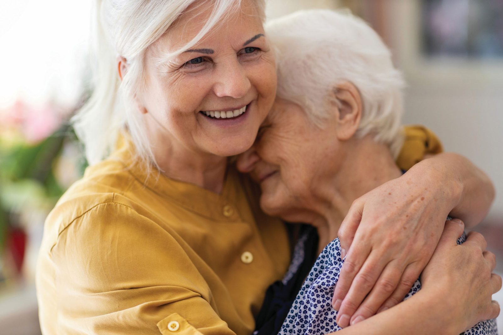 A daughter and mother hugging