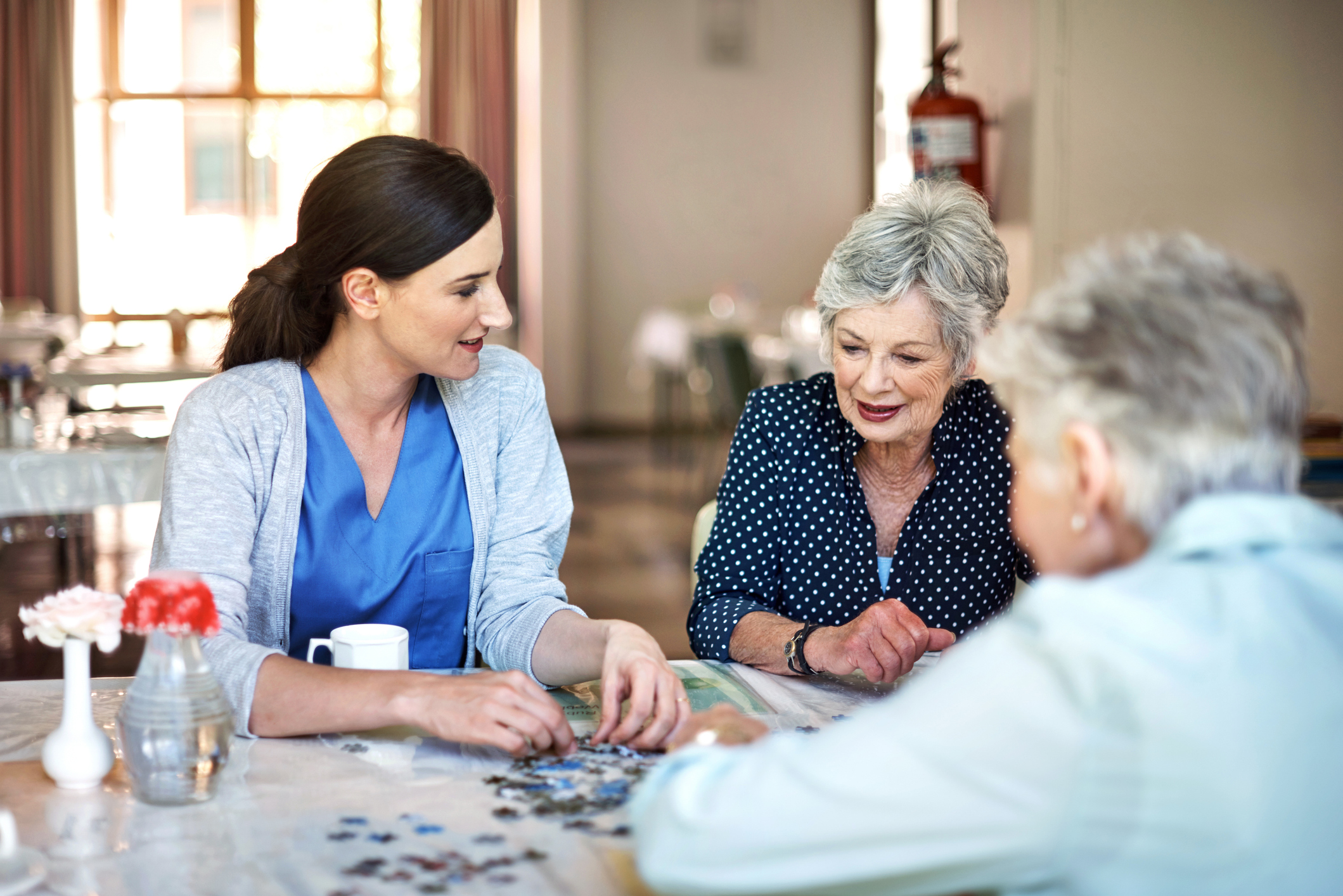 Santa Monica caregiver doing a puzzle with senior