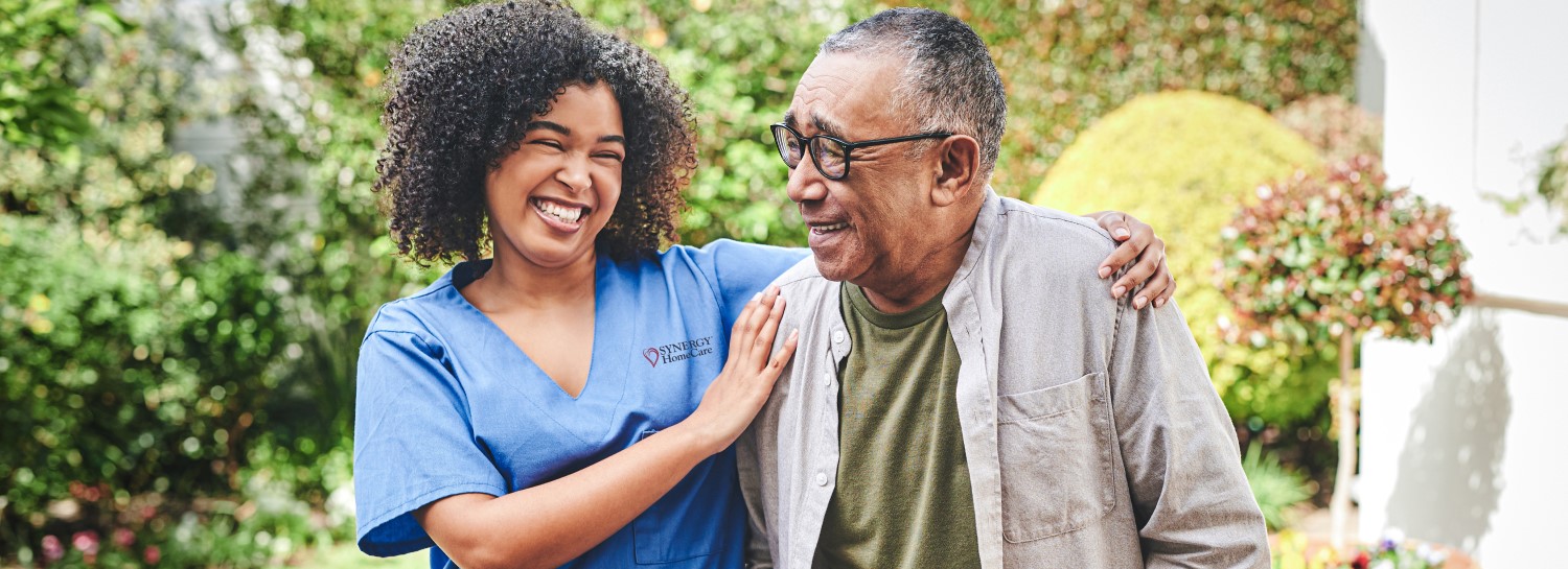 Caregiver walking with care receiver