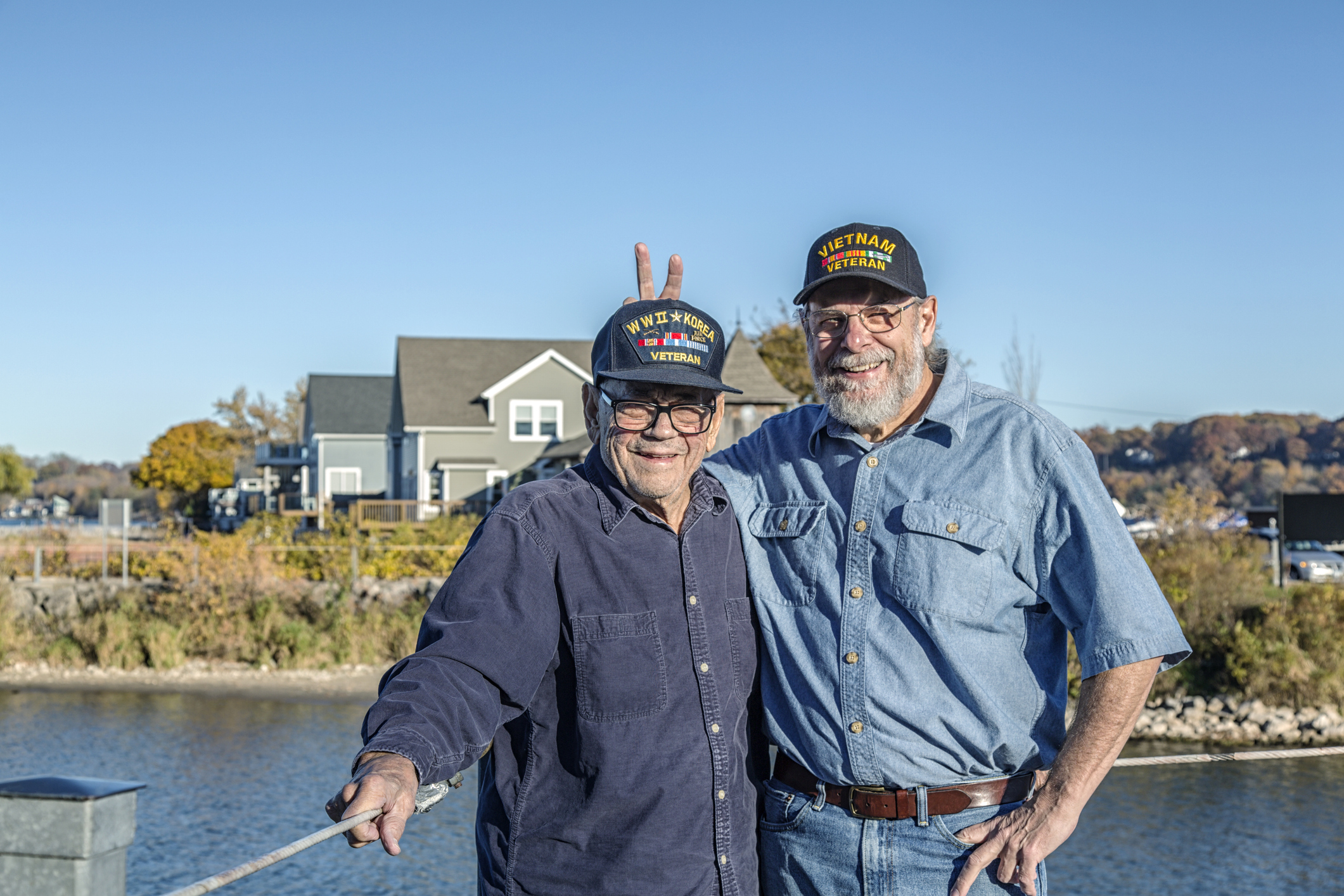 Veterans smiling outside