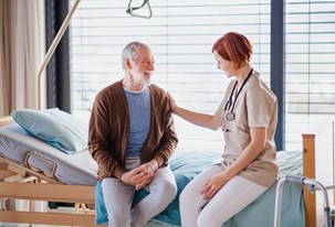 bigstock-a-female-doctor-talking-to-sen-350126770.jpg