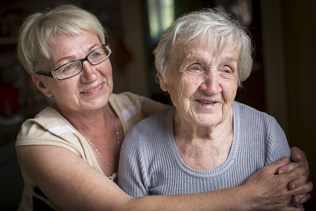 bigstock-an-elderly-woman-with-her-adul-131370128-2.jpg