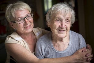 bigstock-an-elderly-woman-with-her-adul-131370128.jpg
