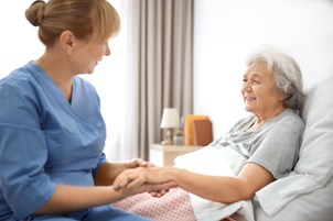 bigstock-caregiver-massaging-hand-of-se-221342581-3.jpg