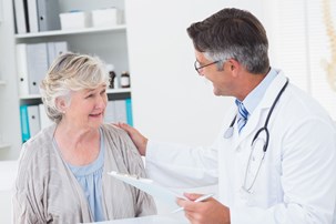 bigstock-male-doctor-consoling-senior-w-84762926.jpg
