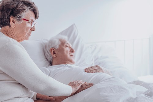 elderly wife with bedridden husband