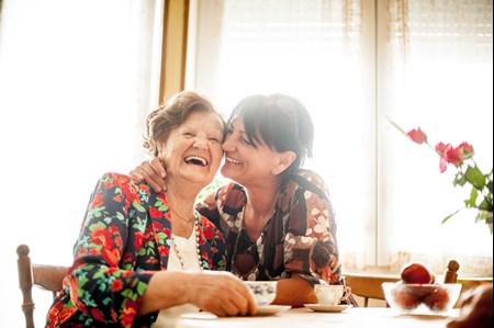 Happy Adult Daughter with her senior mother