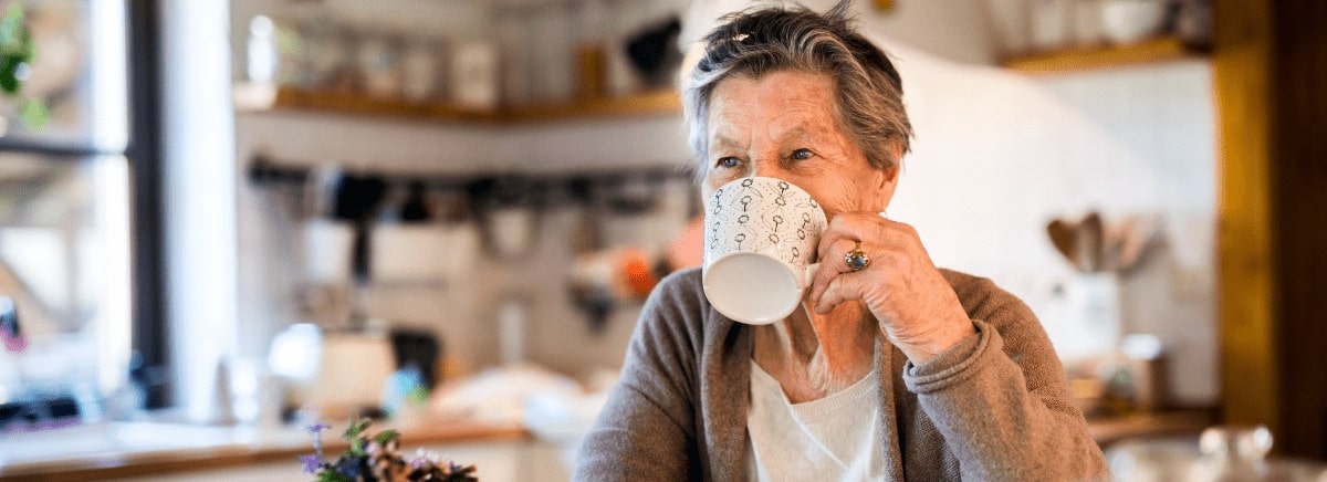 senior woman drinking a cup of coffee