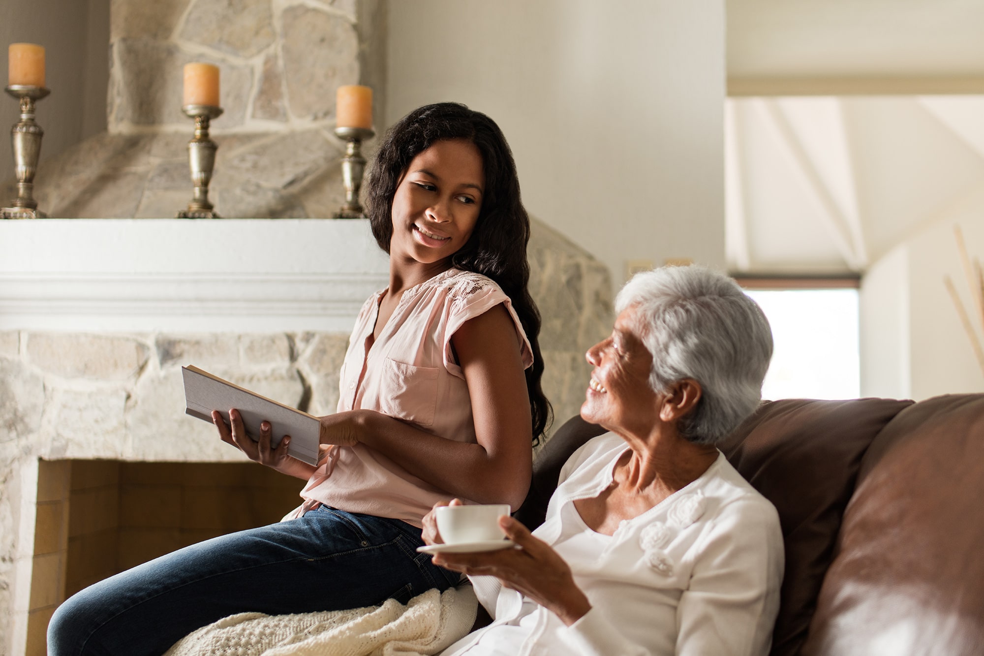 Latin senior woman and granddaughter enjoying a quiet moment at home